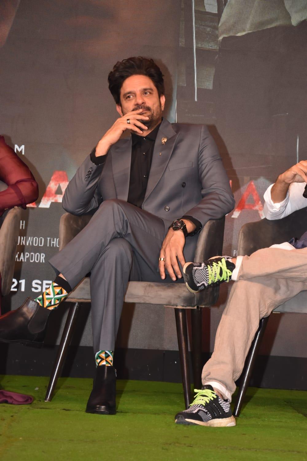 He was seen in a grey suit paired with quirky socks, showcasing his distinct fashion sense. 